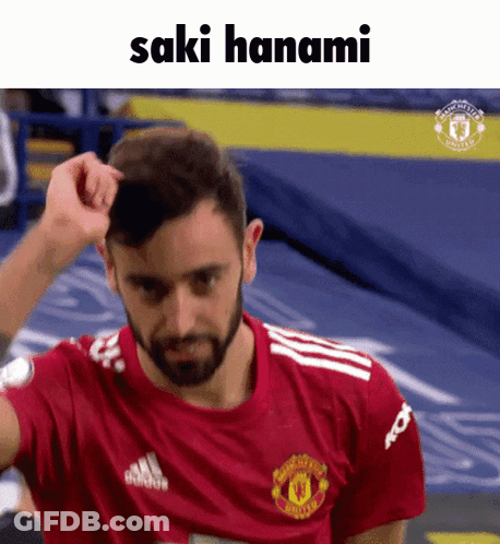 Man In Manchester United Shirt Scratching Head GIF