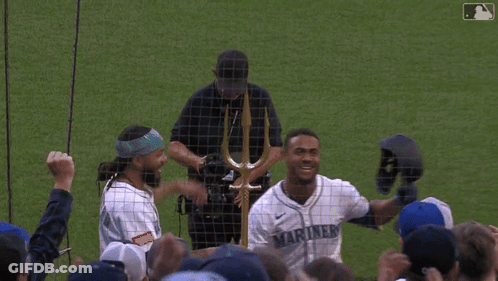Man In Mariners Jersey Holding Helmet GIF