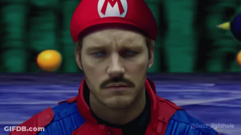 Man In Mario Costume With Red M Hat GIF