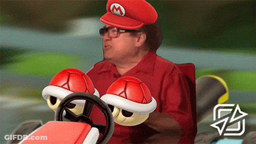 Man In Mario Hat Driving Red Car GIF