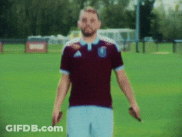 Man In Maroon Adidas Shirt On Green Field GIF