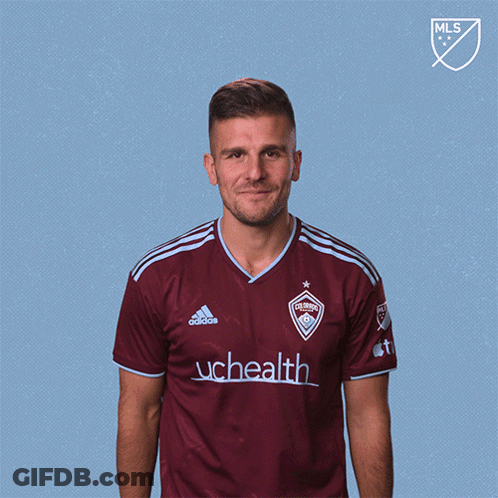 Man In Maroon Adidas Shirt With UCHealth GIF