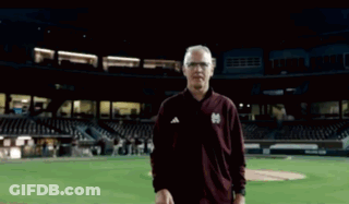 Man In Maroon Jacket With Letter M GIF