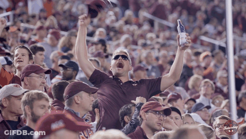 Man In Maroon Shirt Holding Budweiser GIF