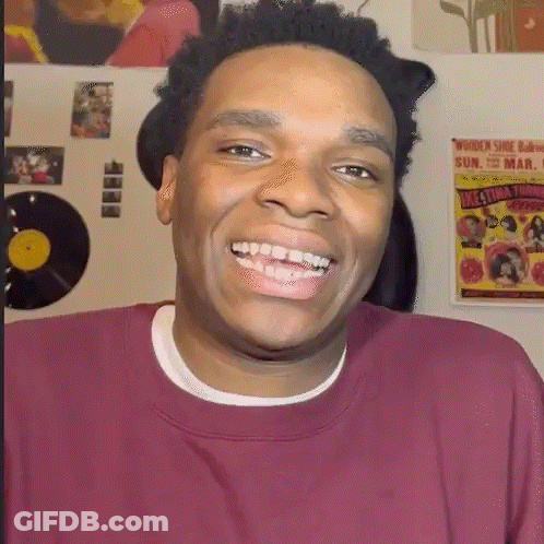 Man In Maroon Shirt Smiling At Women Shoe Bar GIF