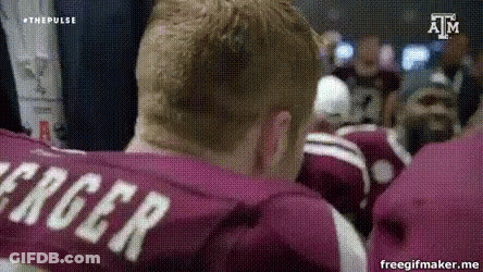 Man In Maroon Shirt With Name Roger On Back GIF