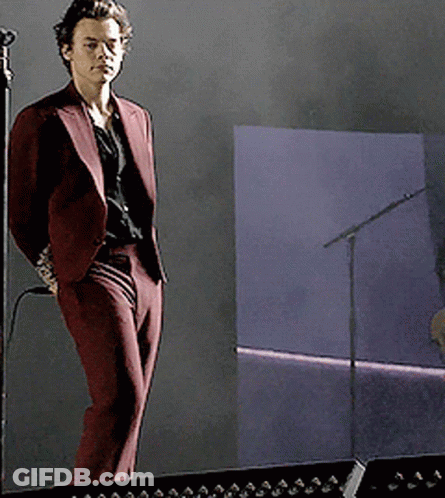 Man In Maroon Suit At Microphone GIF