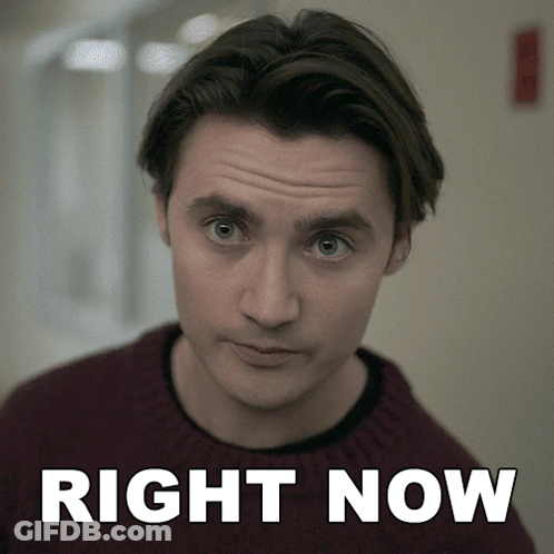 Man In Maroon Sweater Before Right Now Sign GIF