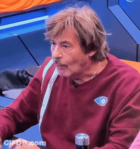 Man In Maroon Sweater With Blue Eye GIF