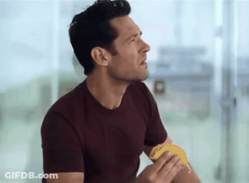 Man In Maroon T-Shirt Eating Food GIF