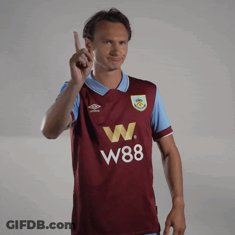 Man In Maroon W88 Jersey Pointing Up GIF