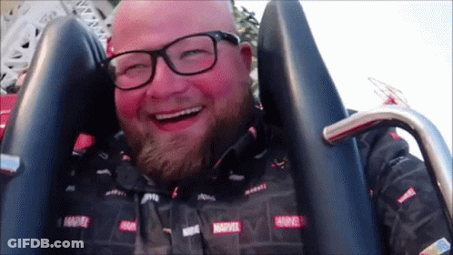 Man In Marvel Shirt Smiling GIF