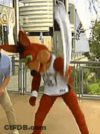 Man In Mascot Costume Standing Next To Mascot GIF