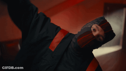 Man In Mask And Black Jacket Smoking Cigarette GIF