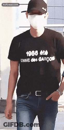 Man In Mask And Black T-Shirt Walking GIF