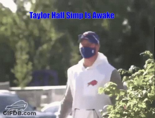 Man In Mask And Buffalo Bills Shirt Walking GIF