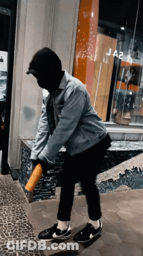 Man In Mask And Denim Jacket At Ja2 Store GIF