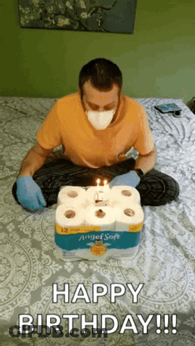 Man In Mask And Gloves Birthday With Toilet Paper Rolls GIF