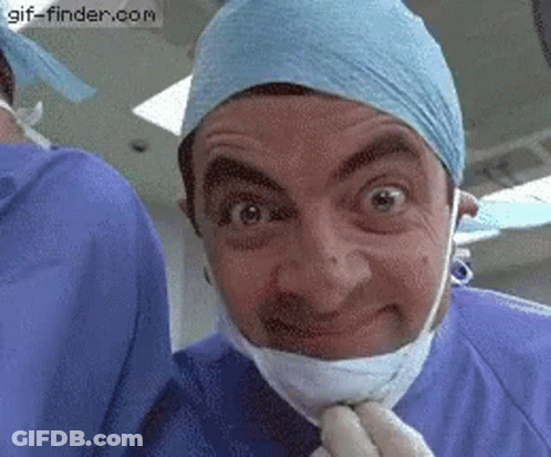 Man In Mask And Gloves Making Funny Face GIF