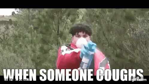 Man In Mask And Gloves Pointing Gun GIF