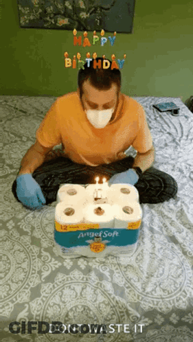 Man In Mask And Gloves With Toilet Paper Cake GIF