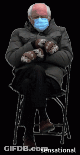 Man In Mask And Mittens Sitting In Chair GIF