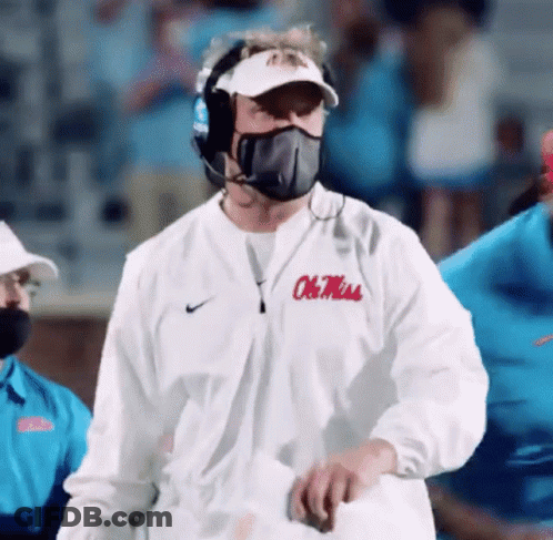 Man In Mask And White Jacket Ole Miss GIF