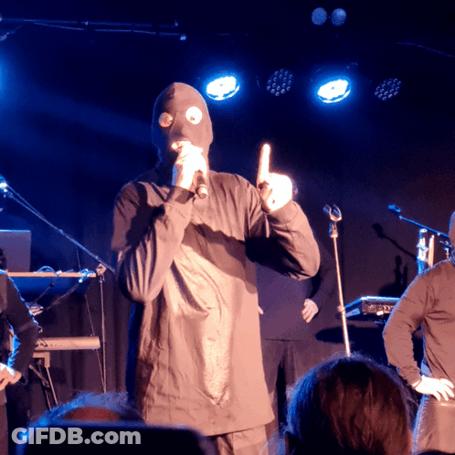Man In Mask At Microphone GIF