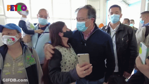 Man In Mask Holding Child GIF