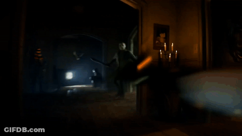 Man In Mask Holding Flashlight GIF