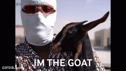 Man In Mask Holding Goat Saying Im The Goat GIF