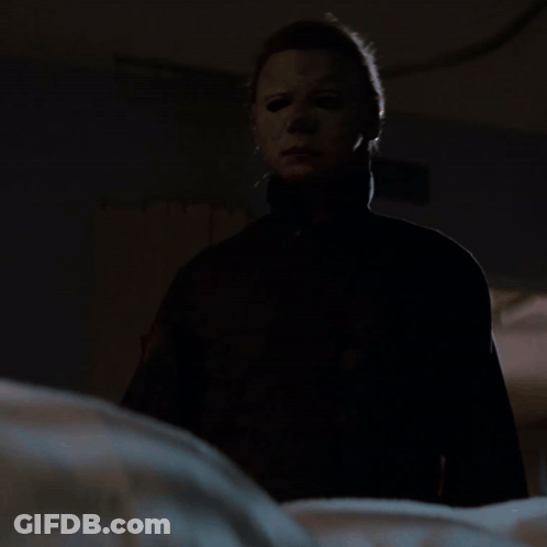 Man In Mask Holding Knife GIF