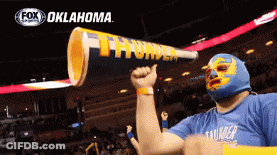 Man In Mask Holding Oklahoma Megaphone GIF