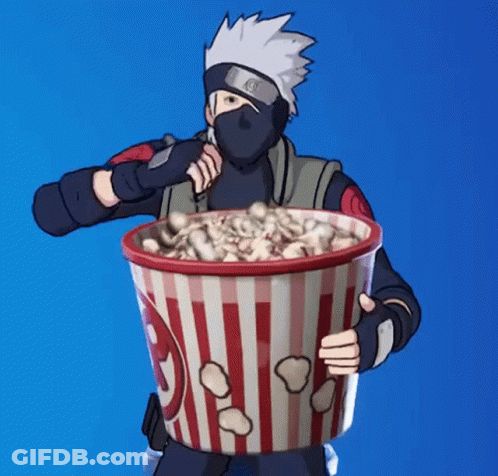 Man In Mask Holding Popcorn Bucket GIF