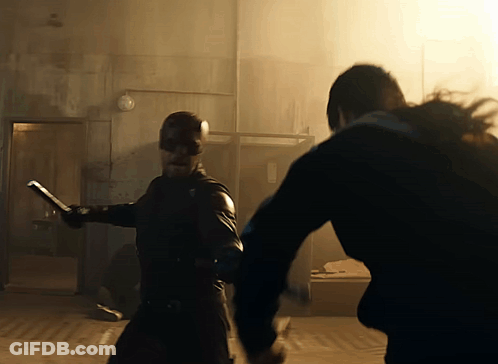 Man In Mask Holding Sword GIF