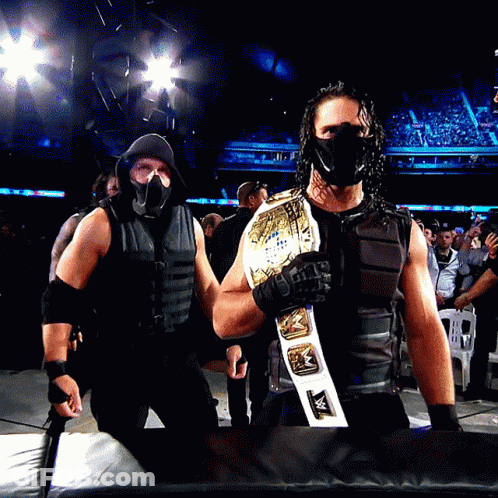 Man In Mask Holding Wrestling Belt GIF