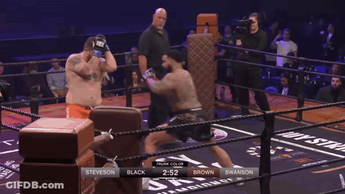 Man In Mask Hugging Wrestler In Chicago Shirt GIF