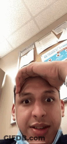Man In Mask Making Funny Face Holding Forehead GIF
