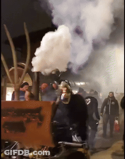 Man In Mask Next To Freedom Sign GIF
