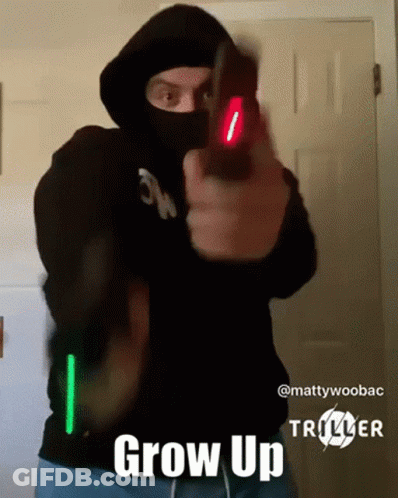 Man In Mask Pointing Gun Saying Grow Up GIF