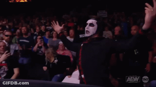 Man In Mask Says You're Cursed In Front Of Crowd GIF