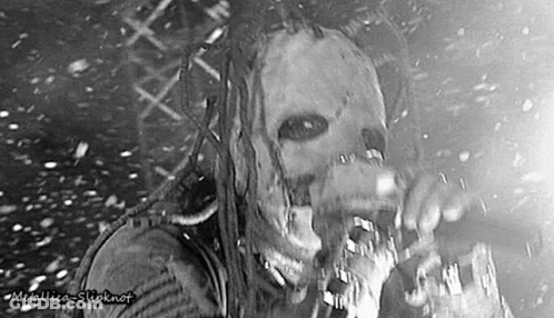 Man In Mask Singing Into Microphone GIF