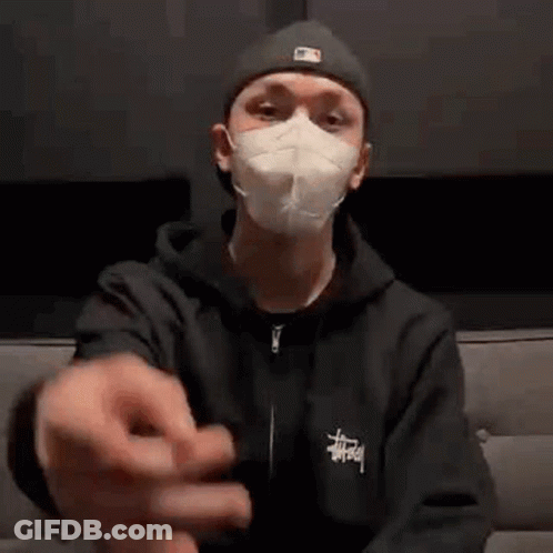 Man In Mask Sitting On Couch GIF