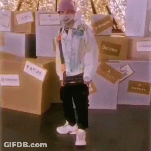 Man In Mask Standing In Front Of Boxes GIF