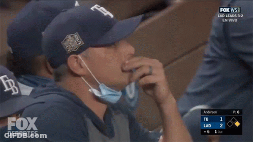 Man In Mask Watching Fox Deportes Baseball GIF
