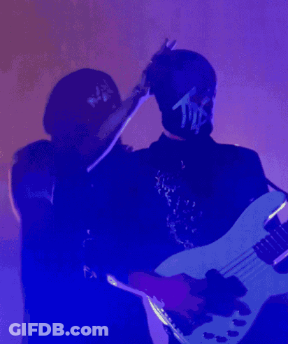 Man In Mask With Letter T GIF