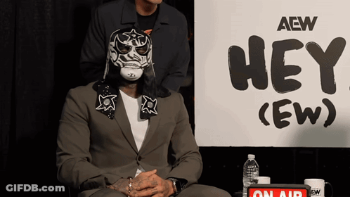 Man In Mask With Sign Hey (Ew) GIF