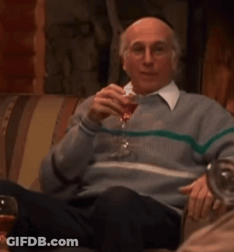 Man In McM Jacket Sitting In Front Of Store Shelf GIF
