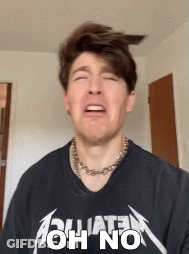 Man In Metallica Shirt Making Sad Face GIF