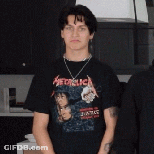 Man In Metallica T-Shirt Standing In Kitchen GIF